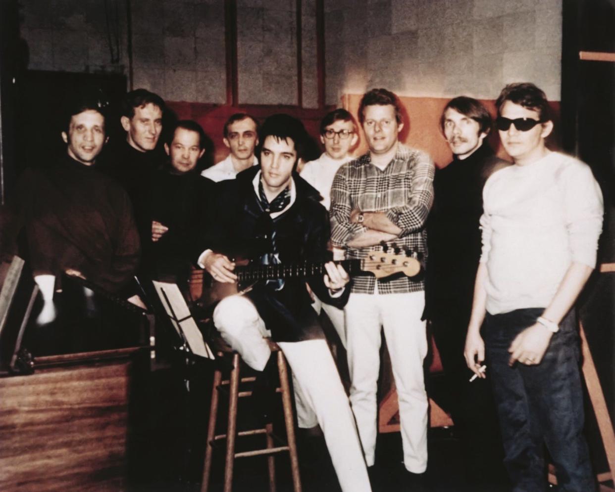 Elvis Presley at American Sound Studios with members of The Memphis Boys band.