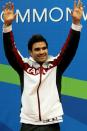 DELHI, INDIA - OCTOBER 11: Alexandre Despatie of Canada celebrates prior to receiving the gold medal won in the Men's 3m Springboard Final at Dr. S.P. Mukherjee Aquatics Complex during day eight of the Delhi 2010 Commonwealth Games on October 11, 2010 in Delhi, India. (Photo by Phil Walter/Getty Images)