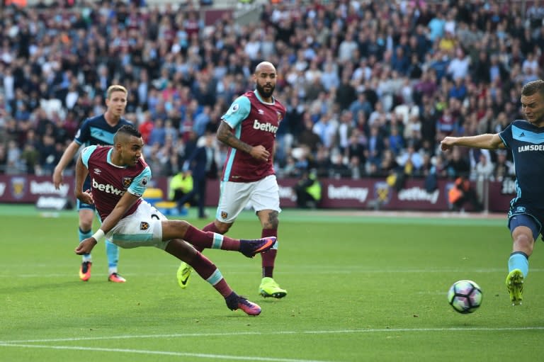 West Ham United's French midfielder Dimitri Payet (L) scores their first to equalise 1-1 against Middlesbrough at The London Stadium, in east London on October 1, 2016