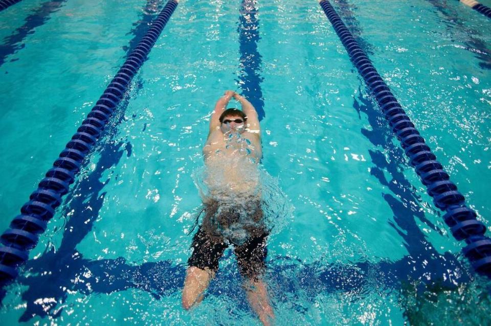 Sean Brame pushes off the wall for a cool down set of back stroke during a workout on Feb. 25, 2015 at the Penn State Natatorium. Brame was training to compete in the 2020 Paralympics.
