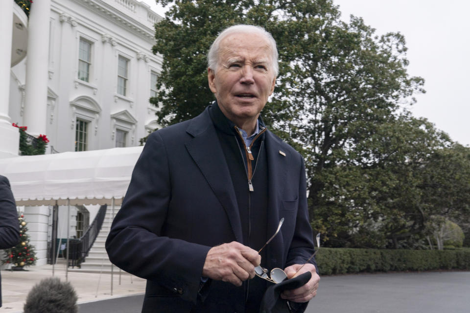 President Joe Biden speaks to members of the media as he leaves the White House to spend the Christmas holiday with his family at Camp David presidential retreat, near Thurmont, Md., Saturday, Dec. 23, 2023. (AP Photo/Manuel Balce Ceneta)