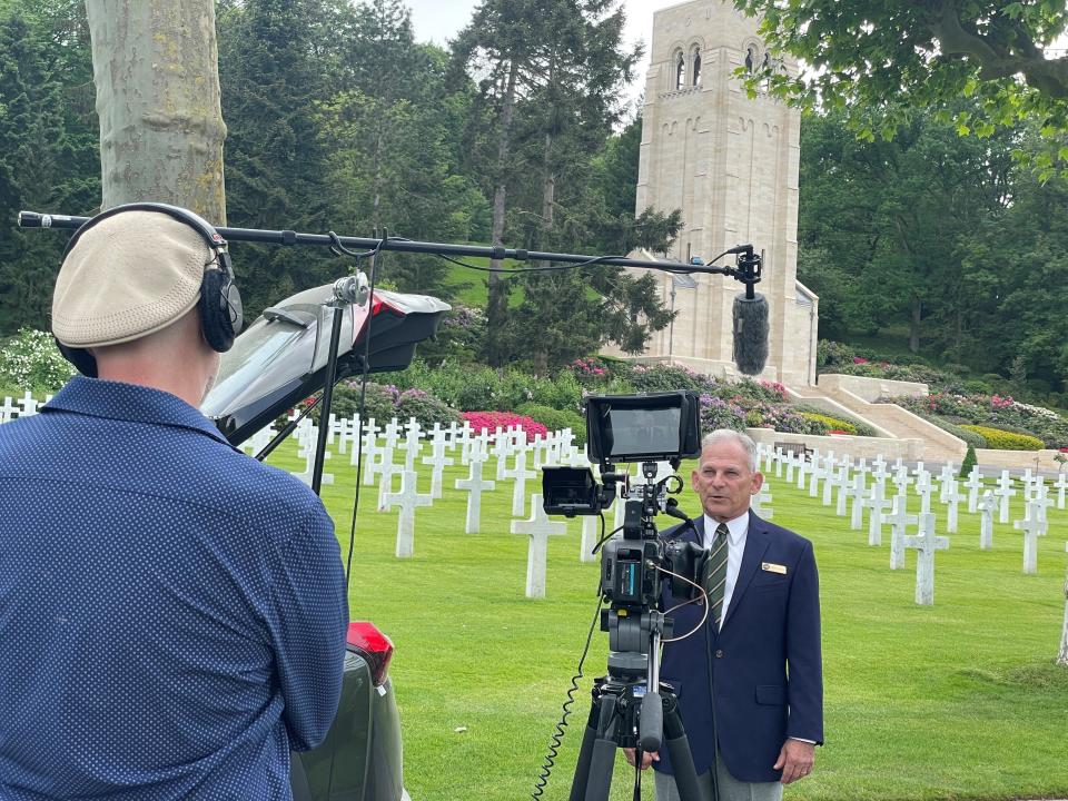 Bloomington flmmaker Jo Throckmorton interviews historian Burt Caloud at Aisne Marne Cemetery in France.