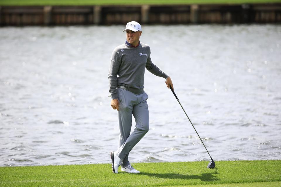 Defending Players champion Justin Thomas waits his turn on the 18th fairway of the Players Stadium Course on Saturday in The Players Championship.