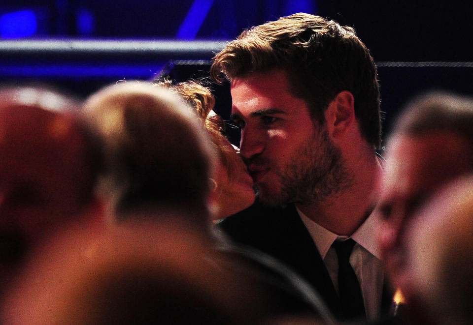 Actor Liam Hemsworth kisses actress Miley Cyrus at their table at the Muhammad Ali's Celebrity Fight Night XVIII on March 24, 2012 in Phoenix, Arizona. Fight Night supports the fight against Parkinson's disease and this year also celebrates Ali's 70th birthday.&nbsp;