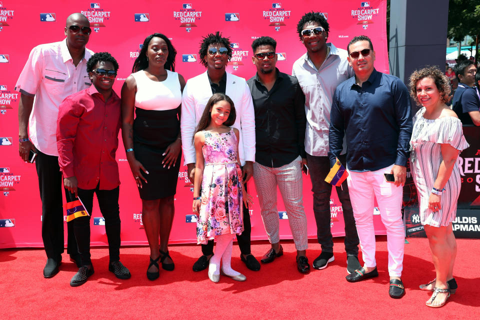 CLEVELAND, OH - JULY 09:  Ronald Acuna Jr. #13 of the Atlanta Braves poses for a photo with his family during the MLB Red Carpet Show presented by Chevrolet at Progressive Field on Tuesday, July 9, 2019 in Cleveland, Ohio. (Photo by Adam Glanzman/MLB Photos via Getty Images)