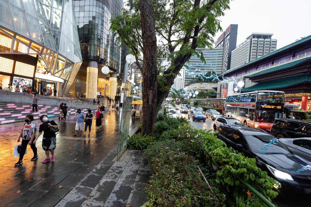 Pedestrians along Orchard Road in Singapore. 