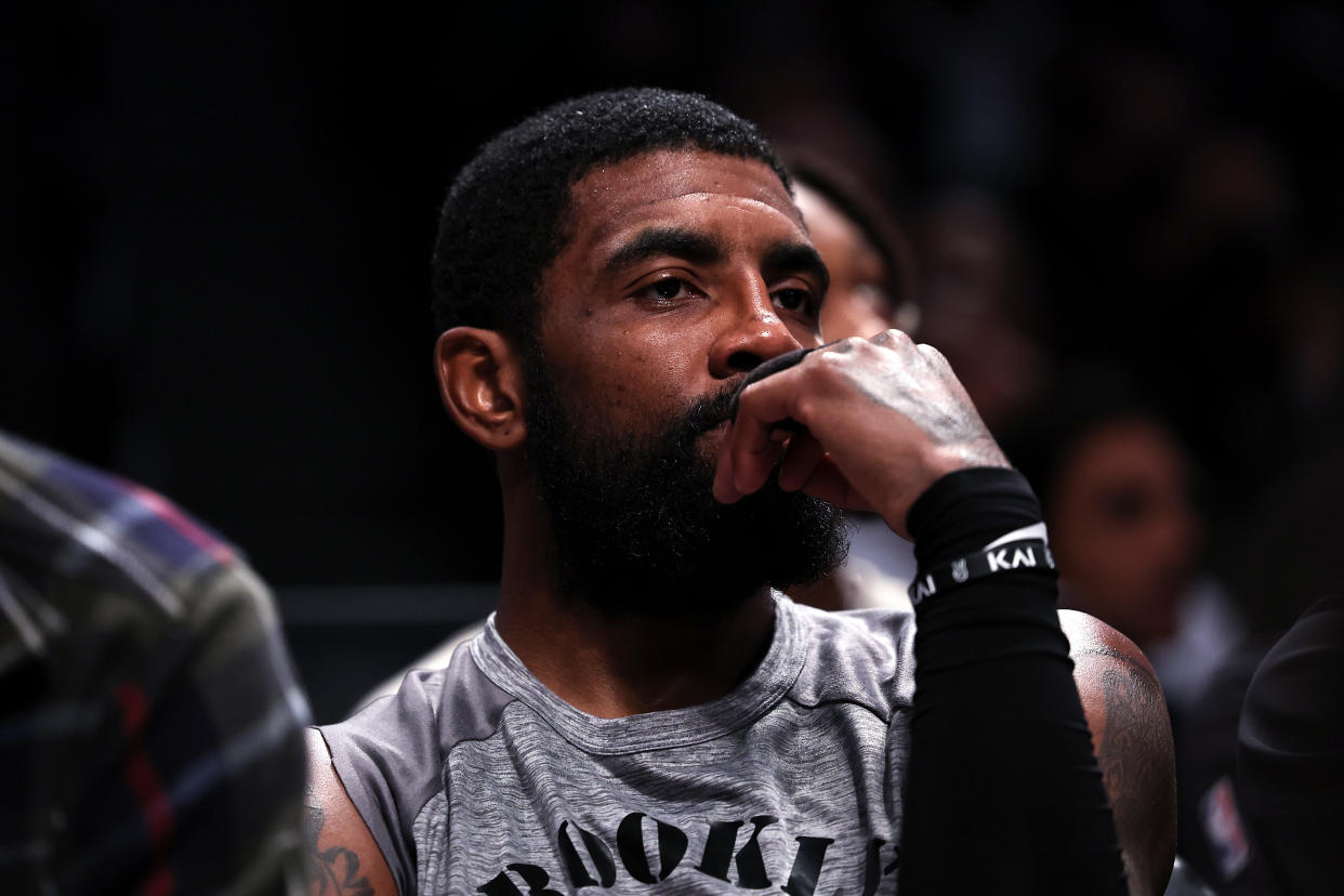 NEW YORK, NEW YORK - NOVEMBER 01: Kyrie Irving #11 of the Brooklyn Nets looks on from the bench during the second quarter of the game against the Chicago Bulls at Barclays Center on November 01, 2022 in New York City. NOTE TO USER: User expressly acknowledges and agrees that, by downloading and or using this photograph, User is consenting to the terms and conditions of the Getty Images License Agreement. (Photo by Dustin Satloff/Getty Images)