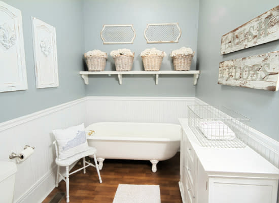 <body> <p>Once the wallpaper came down, a pleasing shade of bluish-gray paint went up in its place. Together with the newly white <a rel="nofollow noopener" href=" http://www.bobvila.com/articles/how-to-install-wainscoting/#.Va-r7ypViko?bv=yahoo" target="_blank" data-ylk="slk:wainscoting;elm:context_link;itc:0;sec:content-canvas" class="link ">wainscoting</a>, lighter colors transformed the room almost instantly. A well-placed dresser provides much-needed built-in storage, while friendly hand-painted signs reminding visitors to brush and floss add charm to the once-bare walls.</p> <p><strong>Related: <a rel="nofollow noopener" href=" http://www.bobvila.com/slideshow/12-easy-ways-to-boost-bathroom-storage-16467#.Va-sQCpVikp?bv=yahoo" target="_blank" data-ylk="slk:12 Easy Ways to Boost Bathroom Storage;elm:context_link;itc:0;sec:content-canvas" class="link ">12 Easy Ways to Boost Bathroom Storage</a> </strong> </p> </body>