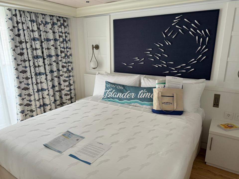 The bed in a Signature Grand Suite on Islander.