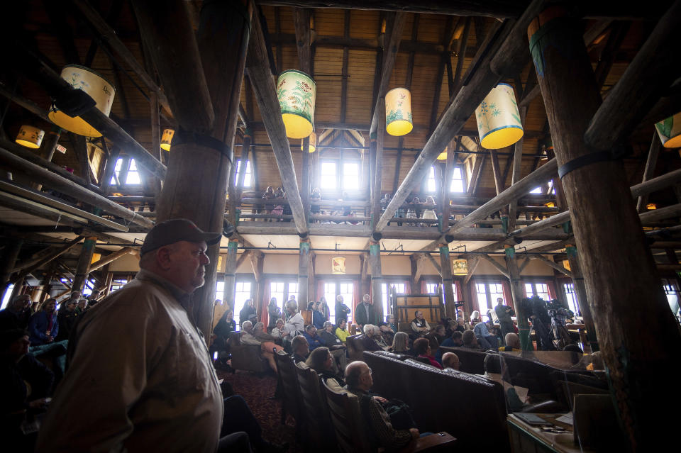 People fill the lobby of the Paradise Inn to watch during a grand opening event for the renovated Paradise Inn at Mount Rainier National Park in Paradise, Wash., on Friday, May 17, 2019. The Paradise Inn recently completed the second and final phase of a renovation project. (Joshua Bessex/The News Tribune via AP)