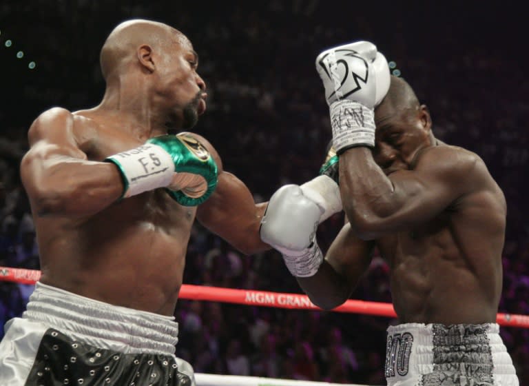 With the win Floyd Mayweather (L) equals the perfect 49-0 record of heavyweight legend Rocky Marciano and retains his WBA and WBC titles, embellishing his reputation as the best boxer of his generation