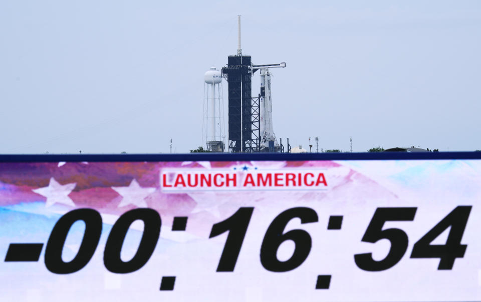 A SpaceX Falcon 9, with NASA astronauts Doug Hurley and Bob Behnken in the Dragon crew capsule, prepare to lift off from Pad 39-A at the Kennedy Space Center in Cape Canaveral, Fla., Wednesday, May 27, 2020. The veicle is venting as the mission was scrubbed. The launch of a SpaceX rocket ship with two NASA astronauts on a history-making flight into orbit was been called off with 16 minutes to go in the countdown because of the danger of lightning. (AP Photo/David J. Philip)