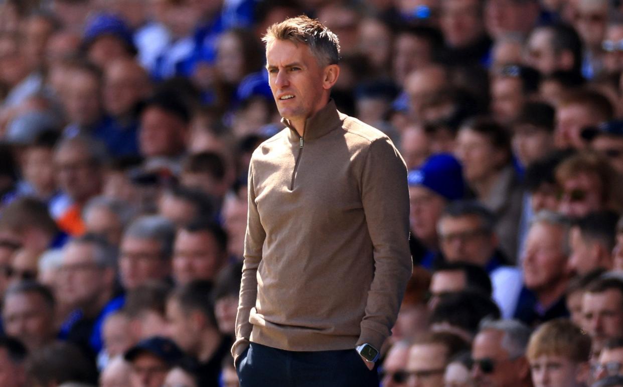 Kieran McKenna watches his side beat Huddersfield to secure promotion.