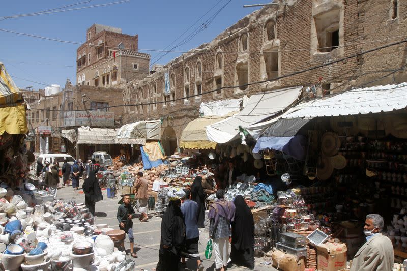 People shop at a market in the old quarter of Sanaa