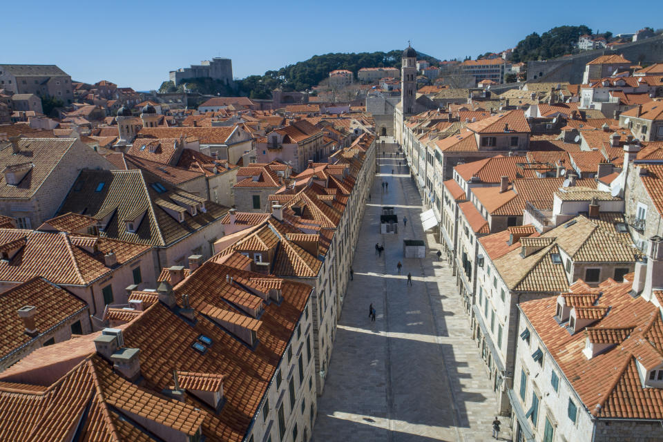 This Tuesday, March 17, 2020 aerial photo shows the old town of Dubrovnik, Croatia. Just outside the majestic walls of Croatia’s medieval citadel city of Dubrovnik lies a cluster of small stone houses known as the Lazarettos, called Lazareti in Croatian, of Dubrovnik, today an art and clubbing hub and a tourist attraction. But the coronavirus spreads worldwide, some are recalling their original purpose centuries ago as an isolation zone for arrivals who might be carrying infectious diseases. Dubrovnik, on the Adriatic coast, was the first city in Europe to set up a quarantine system, in 1377, as protection from leprosy. The Lazzarettos complex was built in the 17th century when authorities decided to set up the quarantine area closer to the harbor. (AP Photo/Darko Bandic)