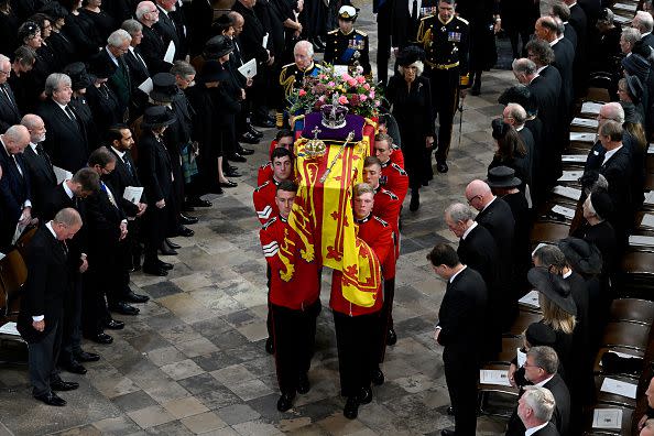 LONDON, ENGLAND - SEPTEMBER 19: The coffin of Queen Elizabeth II with the Imperial State Crown resting on top of it departs Westminster Abbey during the State Funeral of Queen Elizabeth II on September 19, 2022 in London, England. Elizabeth Alexandra Mary Windsor was born in Bruton Street, Mayfair, London on 21 April 1926. She married Prince Philip in 1947 and ascended the throne of the United Kingdom and Commonwealth on 6 February 1952 after the death of her Father, King George VI. Queen Elizabeth II died at Balmoral Castle in Scotland on September 8, 2022, and is succeeded by her eldest son, King Charles III.  (Photo by Gareth Cattermole/Getty Images)