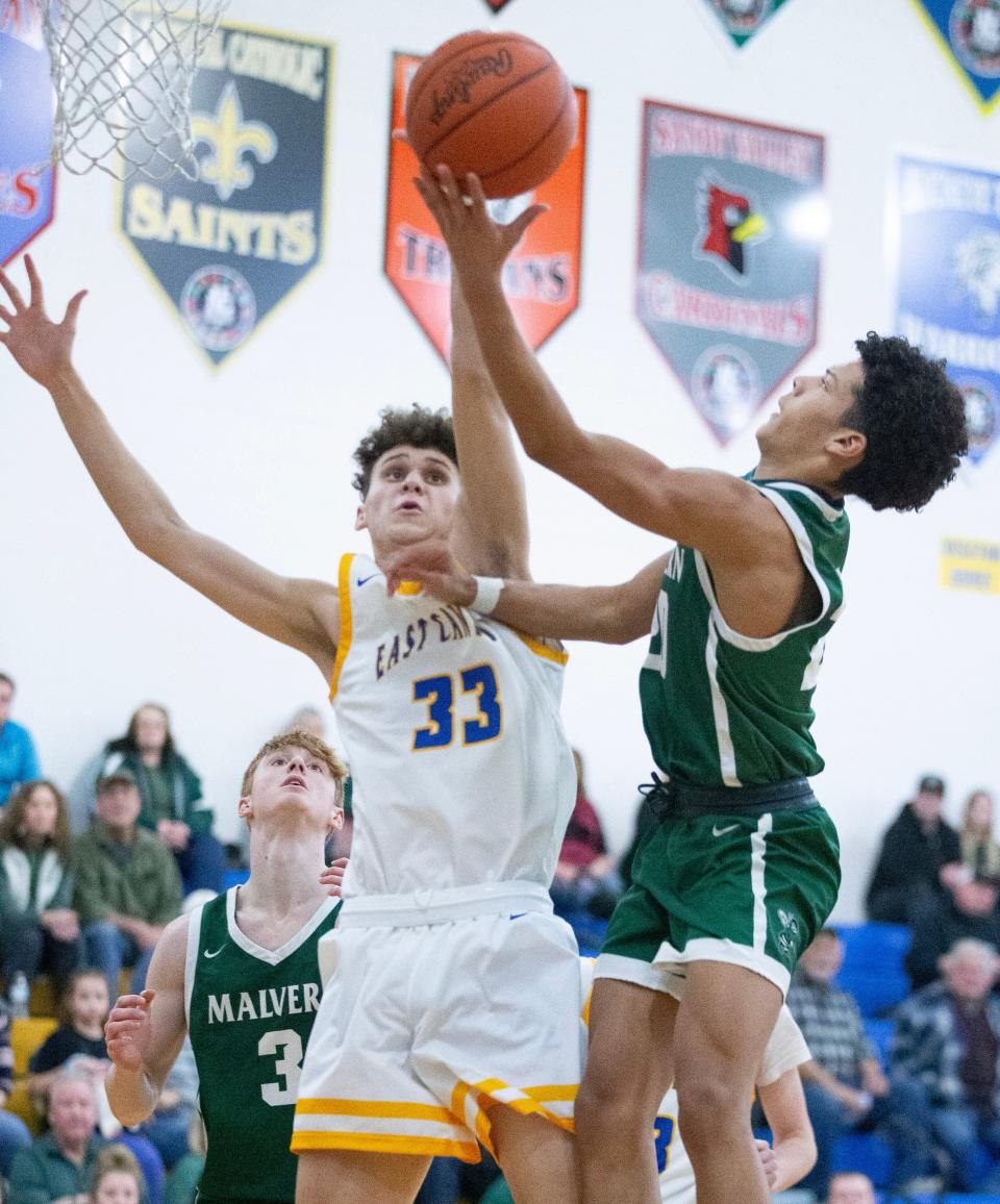 Malvern's Rodney Smith puts up a second-half shot against East Canton's Jaedyn McLeod, Tuesday, Jan. 31, 2023.