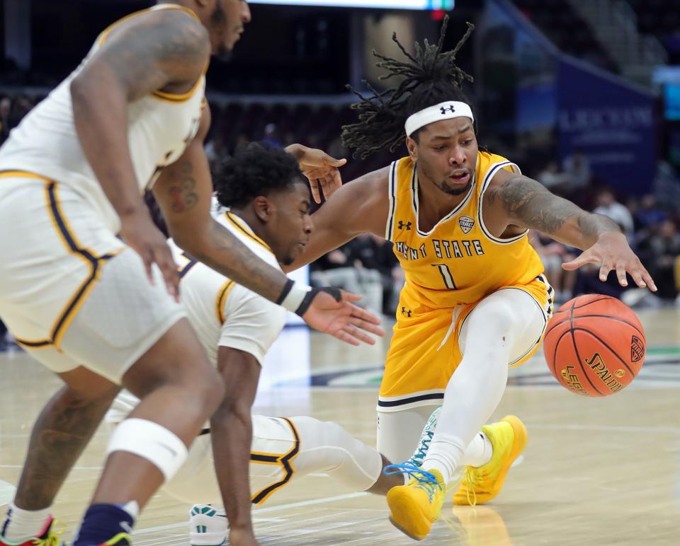 Kent State's VonCameron Davis (1) drives to the basket against against Toledo in the quarterfinals of the Mid-American Conference Tournament on Thursday in Cleveland.