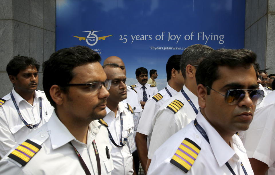Employees of Jet Airways gather to demand clarification on unpaid salaries at Jet Airways headquarters in Mumbai, India, Monday, April 15, 2019. India's ailing Jet Airways has drastically reduced operations amid talks with investors to purchase a controlling stake in the airline and help it reduce its mounting debt. (AP Photo/Rafiq Maqbool)