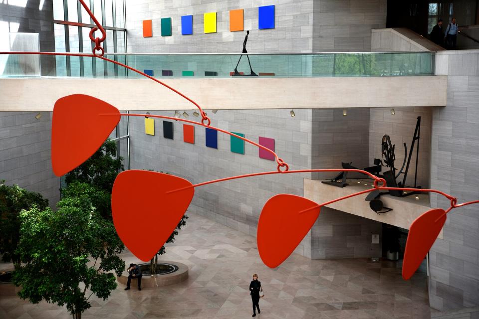 Alexander Calder's untitled aluminum and steel mobile hangs from the ceiling above visitors at the National Gallery of Art East Building on the National Mall in Washington, D.C.