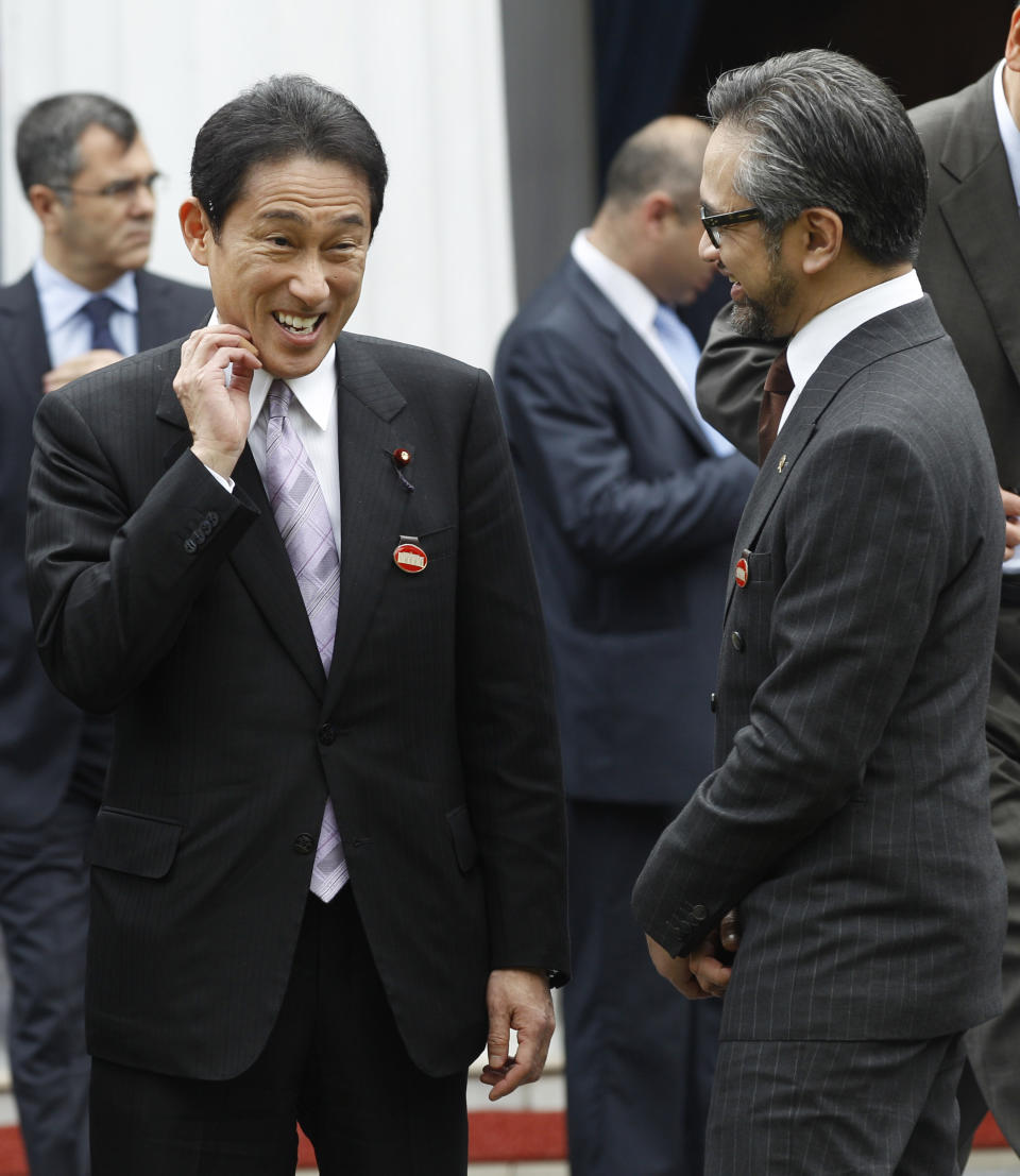 Indonesian Foreign Minister Marty Natalegawa, right, talks with his Japanese counterpart Fumio Kishida during the 2nd Conference on Cooperation among East Asian Countries for Palestinian Development (CEAPAD) in Jakarta, Indonesia, Saturday, March 1, 2014. (AP Photo/Achmad Ibrahim)