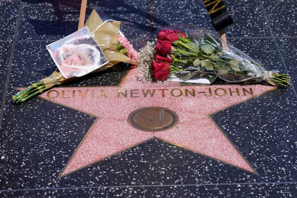 Flowers adorn Olivia Newton-John’s Hollywood Walk of Fame star in Los Angeles, Monday, Aug. 8, 2022. Newton-John, the Grammy-winning superstar who reigned on pop, country, adult contemporary and dance charts with such hits as “Physical” and “You’re the One That I Want” has died. The singer, who had connections to Florida, was 73.