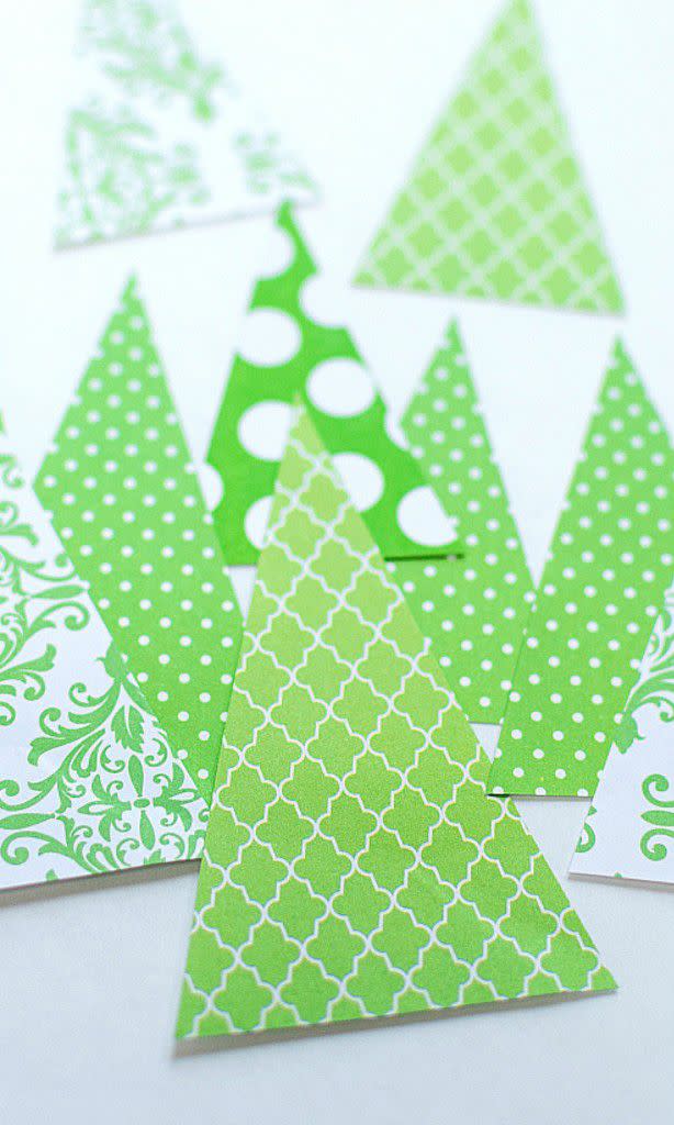 <p>Take all your leftover scrapbook paper in the any green pattern you have, and easily upcycle it all into pretty evergreens. You can use these on a card, and then, if you have any extras, stand them up for a 3D decoration in your house. (This blogger glued toothpicks into the back and stuck them in red Hershey's Kisses to stand them up.)</p><p><em><a href="https://www.itallstartedwithpaint.com/christmas-crafts-with-kids-kisses/" rel="nofollow noopener" target="_blank" data-ylk="slk:See the tutorial at It All Started With Paint »;elm:context_link;itc:0;sec:content-canvas" class="link ">See the tutorial at It All Started With Paint »</a></em> <br></p>