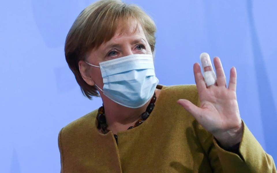 German Chancellor Angela Merkel gestures with a bandaged finger as she leaves after giving a statement, amid the coronavirus disease (COVID-19) pandemic, in Berlin, Germany, April 13, 2021.  - ANNEGRET HILSE 