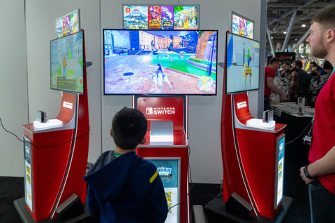 In this photo provided by Nintendo of America, Marcelo, 7, enjoys a demo of the Pokémon Violet game at PAX East.