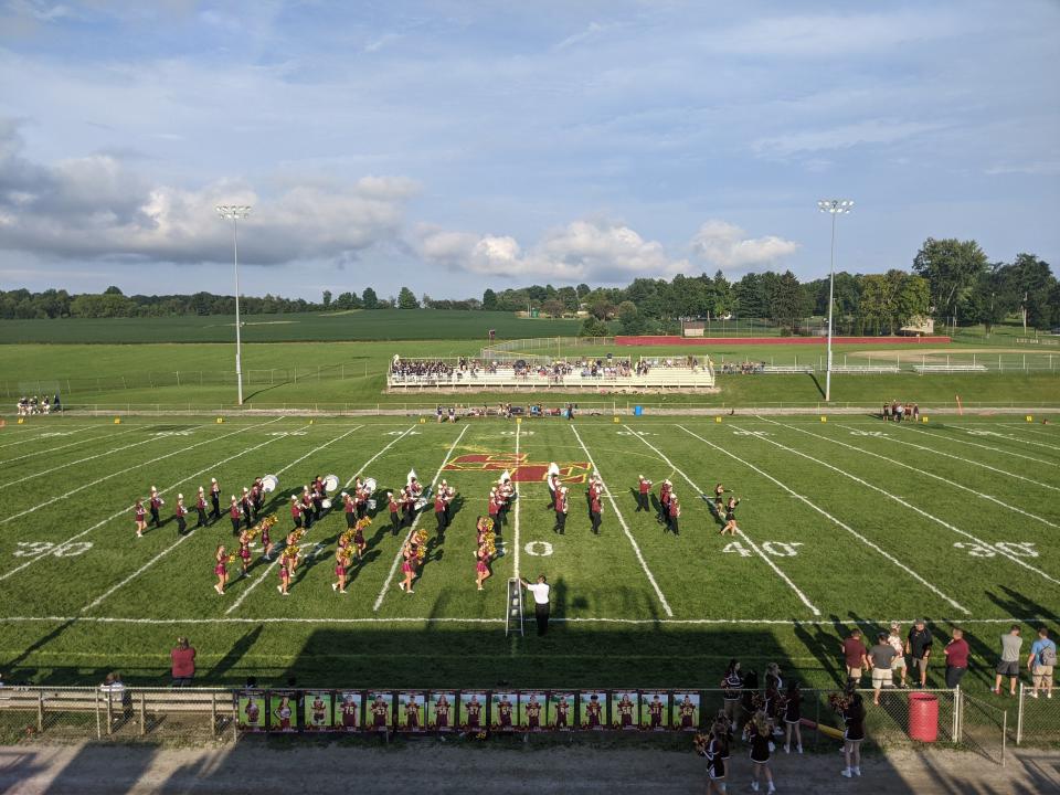 The Southeast band and cheerleaders perform at Freedom Field.
