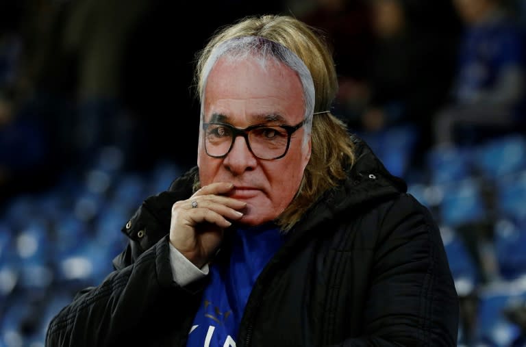 A fan is pictured wearing a mask of Leicester City's former manager Claudio Ranieri at King Power Stadium in Leicester, central England on February 27, 2017