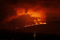 A river of lava flows down from Mauna Loa, Monday, Nov. 28, 2022, near Hilo, Hawaii. Mauna Loa, the world's largest active volcano erupted Monday for the first time in 38 years. (AP Photo/Marco Garcia)