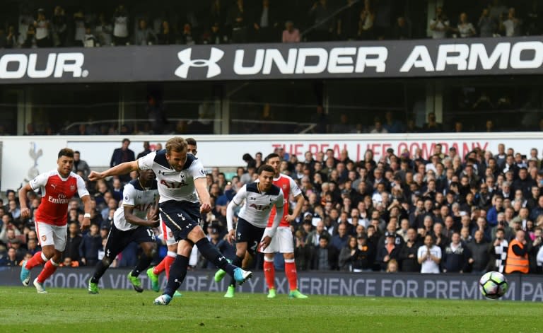 Tottenham Hotspur's striker Harry Kane (C) takes the penalty to score on April 30, 2017