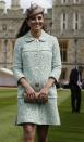 <p>Kate went high-fashion during her first pregnancy, attending an event at Windsor Castle in a mint green Mulberry coat. (Photo: PA) </p>