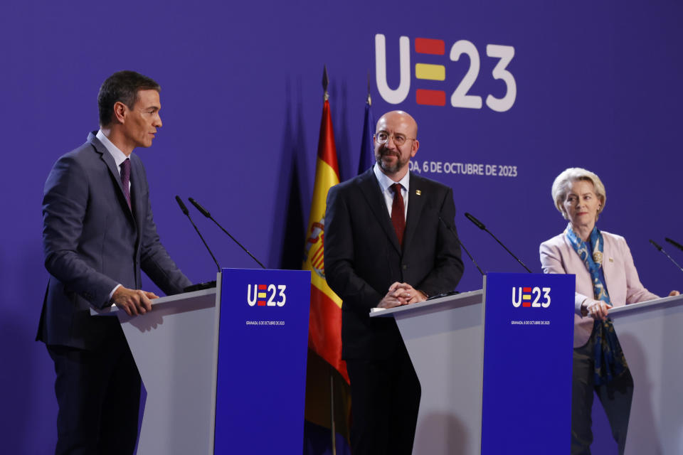 Spain's acting Prime Minister Pedro Sanchez, left, speaks alongside European Council President Charles Michel, centre and European Commission President Ursula von der Leyen during the closing news conference on the 2nd day of the Europe Summit in Granada, Spain, Friday, Oct. 6, 2023. European Union leaders have pledged Ukrainian President Volodymyr Zelenskyy their unwavering support. On Friday, they will face one of their worst political headaches on a key commitment. How and when to welcome debt-laden and war-battered Ukraine into the bloc. (AP Photo/Fermin Rodriguez)