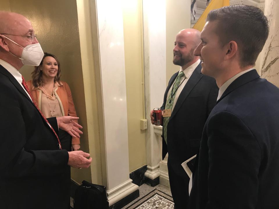 Puffy's co-owner and manager Kittrick Jeffries, right, speaks with other cannabis industry advocates and lobbyists at the Capitol Thursday, including Jeremiah Murphy, Deb Peters and Ned Horsted.