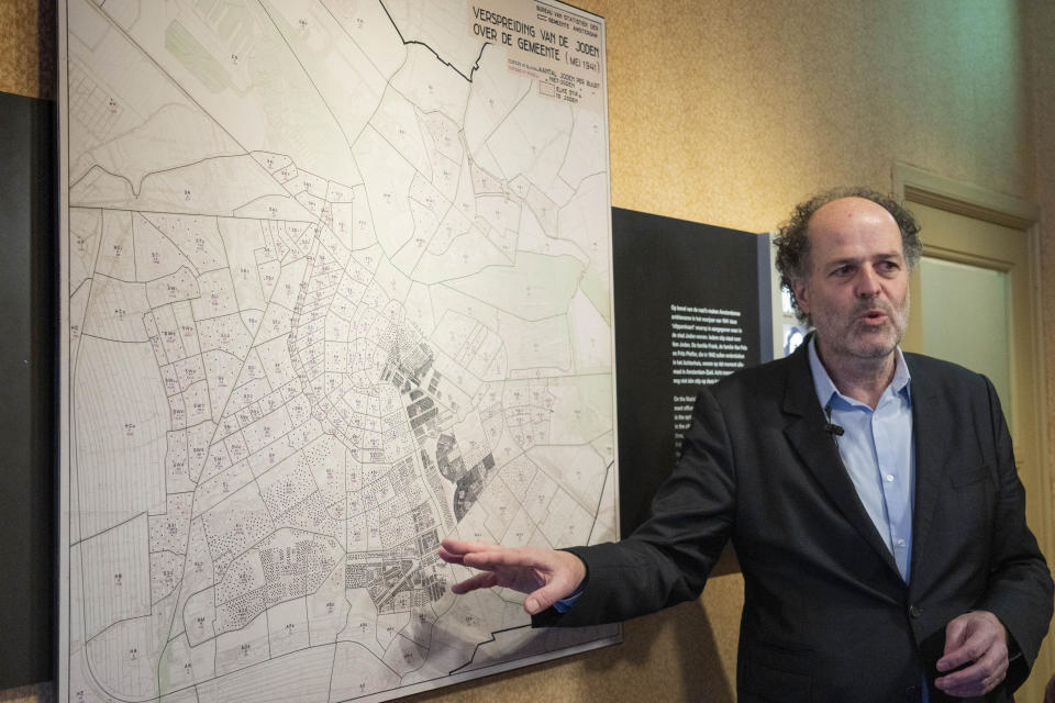 Ronald Leopold, director of the Anne Frank Museum, answers questions next to a map showing the geographical spread of the Jewish community in the capital in May 1941, during an interview in Amsterdam, Netherlands, Monday, Jan. 17, 2022. A cold case team that combed through evidence for five years may have solved one of World War II's enduring mysteries: Who betrayed Jewish teenage diarist Anne Frank and her family? Their answer, outlined in a new book, is that it most likely was a Jewish lawyer called Arnold van den Bergh. (AP Photo/Peter Dejong)