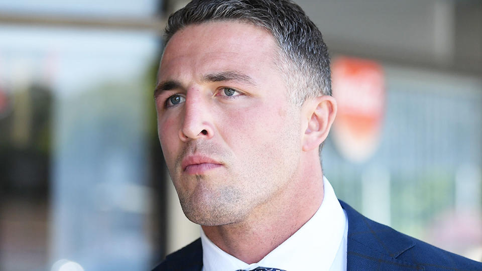 Pictured here, Sam Burgess faces cameras outside court.