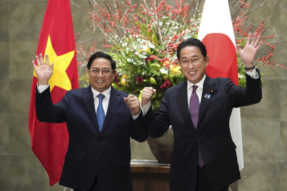 Vietnam's Prime Minister Pham Minh Chinh, left, and Japan's Prime Minister Fumio Kishida pose for photographers ahead of a meeting at the prime minister's official residence in Tokyo, Japan, on Wednesday, Nov. 24, 2021.(Toru Hanai/Pool Photo via AP)