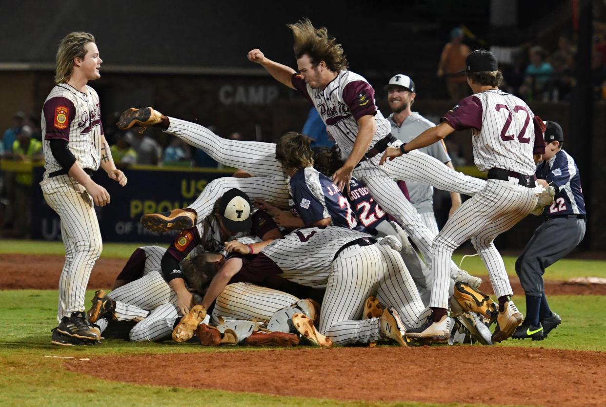 Troy, Alabama, players celebrate after winning the 2022 American Legion World Series on Tuesday, Aug. 17, 2022, at Keever Stadium in Shelby, N.C. Post 70 defeated Idaho Falls, Idaho, 6-5 in the championship game.