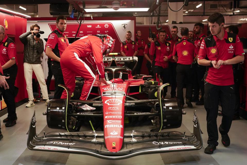 Ferrari driver Carlos Sainz, of Spain, climbs into his car during the final practice session for the Formula One Las Vegas Grand Prix auto race, Friday, Nov. 17, 2023, in Las Vegas. (AP Photo/Darron Cummings)