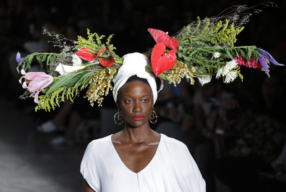 A model wears a creation from the Angela Brito collection during Sao Paulo Fashion Week in Sao Paulo, Brazil, Wednesday, Oct. 16, 2019. (AP Photo/Nelson Antoine)