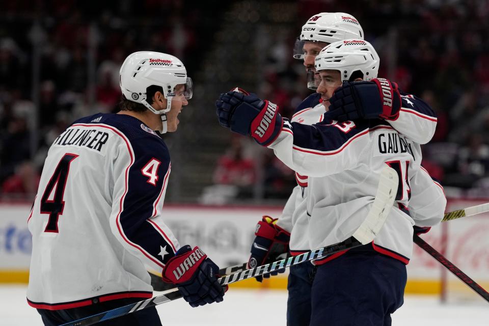 Columbus Blue Jackets left wing Johnny Gaudreau, right, (13) celebrates a second period goal with teammates Columbus Blue Jackets center Cole Sillinger, left, (4) and Columbus Blue Jackets center Boone Jenner during the second period of an NHL hockey game against the Washington Capitals in Washington, Saturday, Nov. 18, 2023. (AP Photo/Susan Walsh)