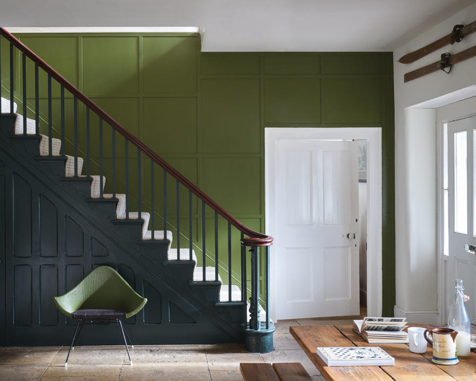 <p> If your hallway is large enough, you can get away with painting a wall with two dark and vibrant shades together. Olive green is on a roll currently, and Farrow & Ball’s version, Bancha No.298, looks rather fabulous with fresh white woodwork and their Studio Green painted on the panelling of the stairs. </p> <p> The neutral runner up the stairs creates a striking contrast right in the middle of the two shades, an intentional feature that’s worth copying.  </p>