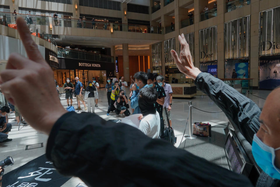 Protesters gather at a shopping mall in Central during a pro-democracy protest against Beijing's national security law in Hong Kong, Tuesday, June 30, 2020. Hong Kong media are reporting that China has approved a contentious law that would allow authorities to crack down on subversive and secessionist activity in Hong Kong, sparking fears that it would be used to curb opposition voices in the semi-autonomous territory. (AP Photo/Vincent Yu)