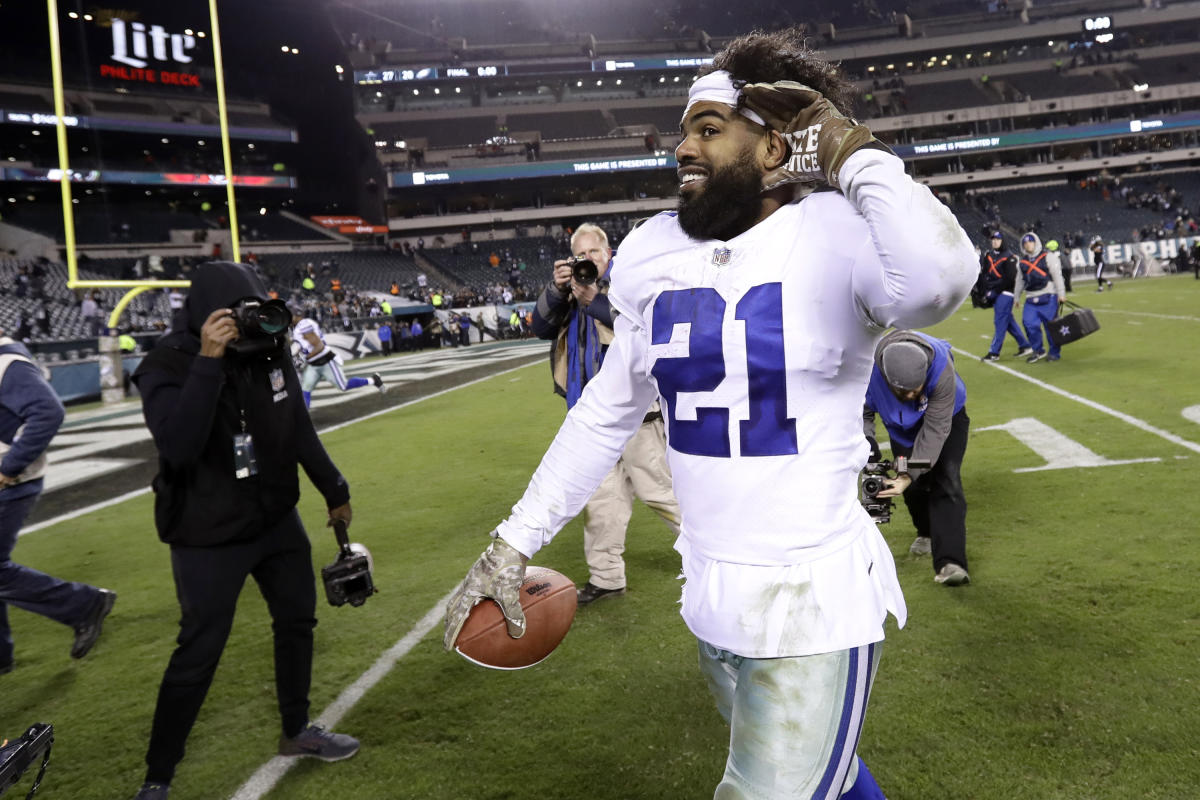 Dallas Cowboys running back Ezekiel Elliott (21) stands on the sideline  during the Pro Football Hall of Fame NFL preseason game against the  Pittsburgh Steelers, Thursday, Aug. 5, 2021, in Canton, Ohio.