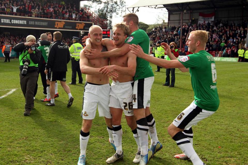 James Coppinger celebrates with Doncaster teammates after scoring the goal that at Brentford that earned promotion to the Championship in 2013.