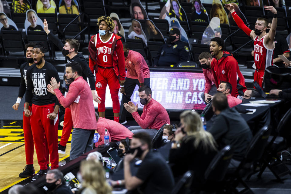 Ohio State players celebrate on the bench in the second half during an NCAA college basketball game against Iowa Thursday, Feb. 4, 2021, in Iowa City, Iowa. (Joseph Cress/Iowa City Press-Citizen via AP)