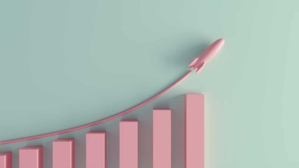 A pastel colored growth chart with a rising rocket.