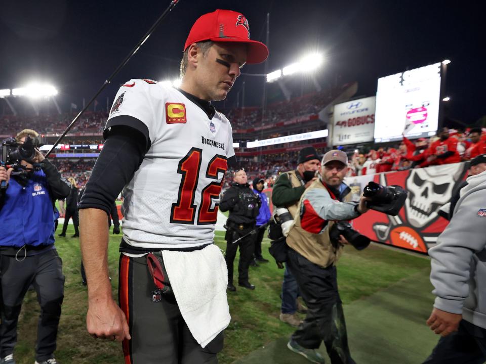 Tom Brady walks off the field after a loss to the Los Angeles Rams.